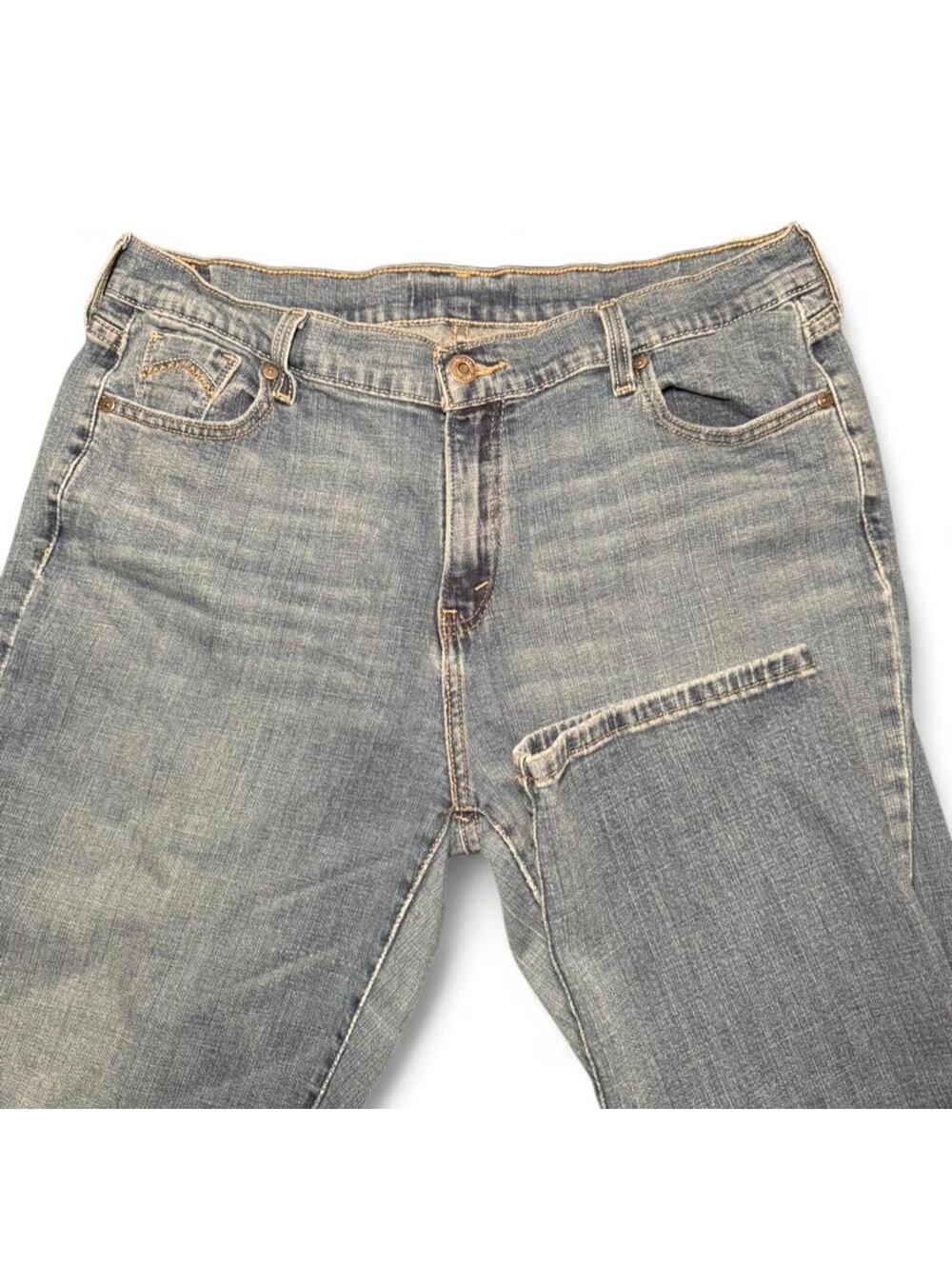 Levi's blue denim jeans with a relaxed fit perfectly worn